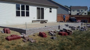 Spartan Landscaping LLC brick patio pavers with wall and arches
