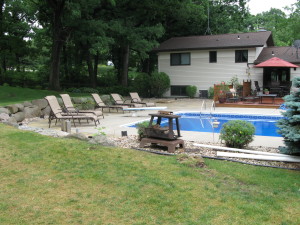 Cottage Grove WI Landscaping Remodel - Pavers, barriers, plants, firepit, inground firepit, mulch, rock, retaining wall, extend pool patio, pavers